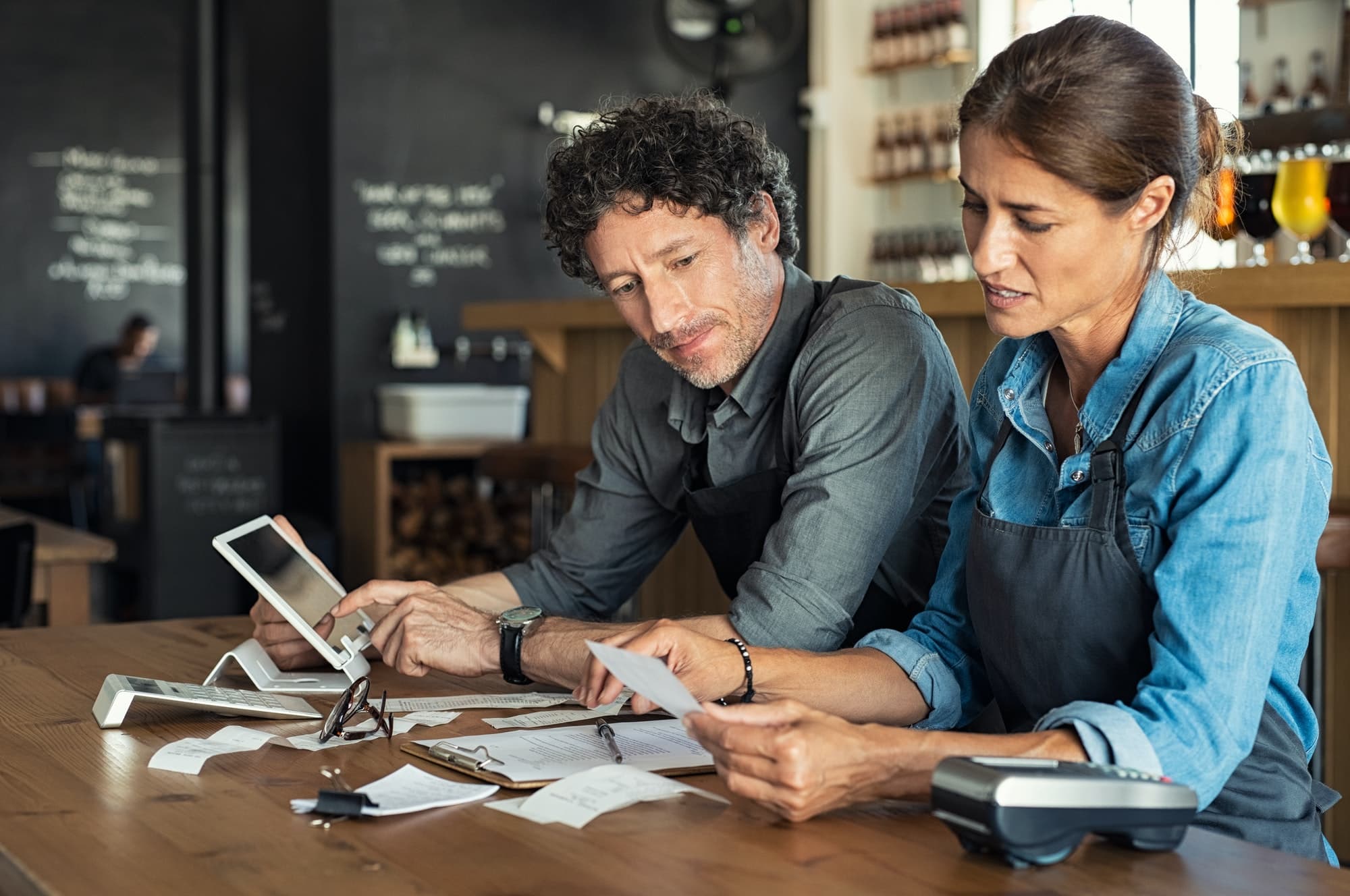 Staff calculating restaurant bill